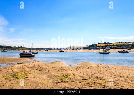 Boats on the beach in the Torridge estuary at Instow, Devon, UK, at low tide, looking upriver Stock Photo