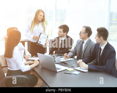 Manager discussing with business team new business plan Stock Photo