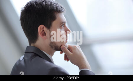 close up.Businessman looking through his office window Stock Photo