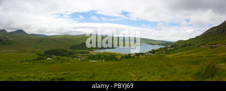 Dunlewey or Dunlewy is a small Gaeltacht village in the Gweedore area of County Donegal, Ireland. It sits in the Poisoned Glen, at the foot of Mount E Stock Photo