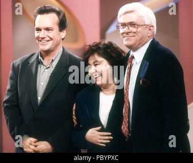 Tom Arnold and Roseanne Barr with Phil Donahue on the Phil Donahue show in 1992. Credit: Adam Scull/PHOTOlink.net /MediaPunch Stock Photo