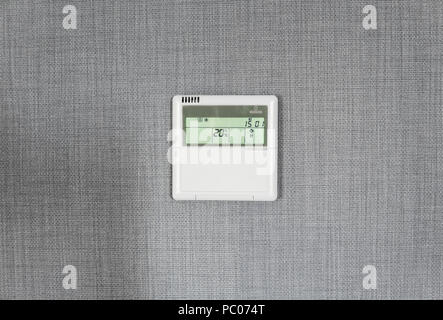 Wall display shows air temperature inside the apartment room. Smart home automation. Showing household consumptions related to temperature and heating. Stock Photo