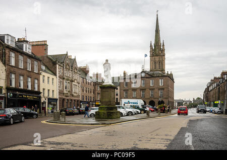 A view of the High Street in Montrose, Scotland looking towards Old and St Andrews Church and the monument to Joseph Hume. Stock Photo