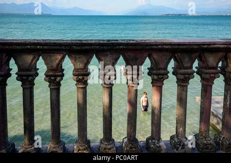 Frame of tourists relaxing on water at Lake Garda, Lombardy, Italy Stock Photo