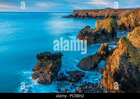 Sunrise over Broad Haven and Church rock, Pembrokeshire Coast National Park, Bosherston, Wales, UK Stock Photo