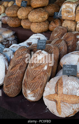 Sourdough bread for sale on a stall at a farmers market. Deddington, Oxfordshire, England Stock Photo