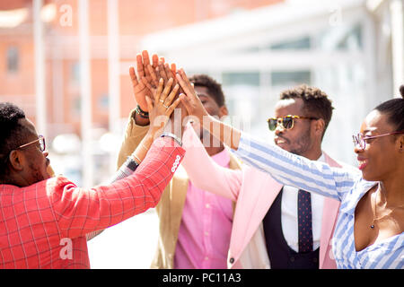 Business Team shows its friendship. friendly young african people joining their hands Stock Photo