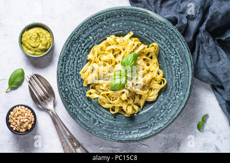 Tagliatelle pasta with pesto sauce and parmesan. Stock Photo