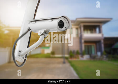 CCTV Camera or surveillance operating with house Stock Photo