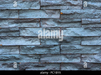 Background of natural decorative black stone tiles, marble brick wall Stock Photo