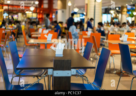 Tables and chairs on food court supermarket Stock Photo