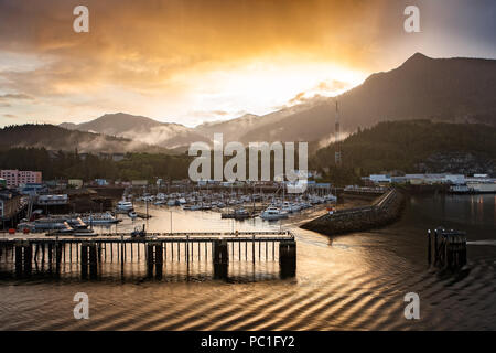 Beautiful Sunrise over the Marina in the Small Harbor at the Port of Skagway in Alaska, USA Stock Photo