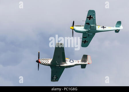 Hispano HA-1112-M1L 'Buchon' Messerschmitt ME109 G-AWHM built in 1958 and formerly belonging to the Spanish Airforce, alongside a 1940 TF-51D Mustang 414251 G-TFSI (Contrary Mary) stationed at Duxford. Stock Photo