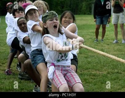 Children competing in a Tug of War challenge Stock Photo