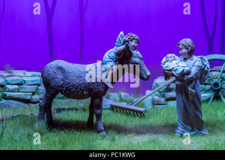 Badajoz, Spain - December 2017: Christmas Nativity scene. Jesus baby hold by two angels. Built by Local At of Friends of Cribs of Badajoz Stock Photo