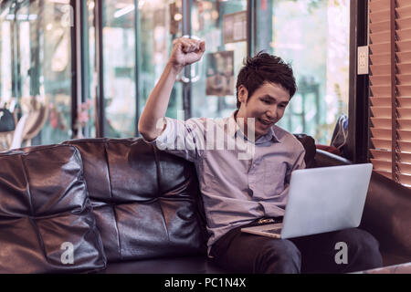 success man using laptop computer in a cafe Stock Photo