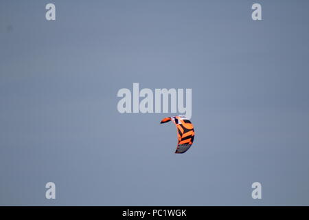 kite flying in blue sky Stock Photo