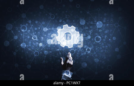 Technology conceptual image with gear digital symbol on dark background Stock Photo