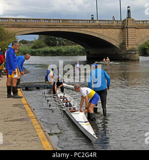 Launching a quad, at Warrington Rowing Club 2018 Summer regatta, Howley lane, Mersey River, Cheshire, North West England, UK