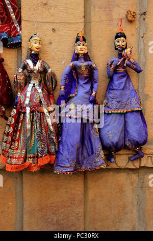 Traditionally dressed up, beautiful dolls on display on walls at Jaisalmer Fort in Jaisalmer, Rajasthan, India, Asia Stock Photo