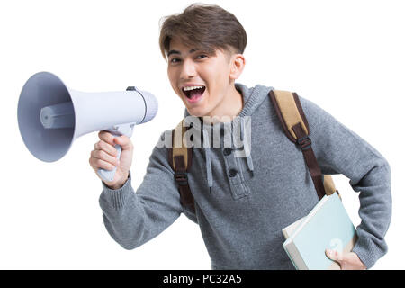 Cheerful male college student shouting through megaphone Stock Photo