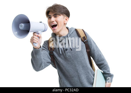 Cheerful male college student shouting through megaphone Stock Photo