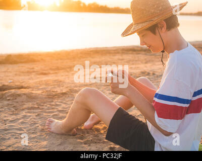 lifestyle young person walking with penny board in the city park Stock Photo