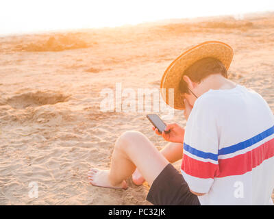 lifestyle young person walking with penny board in the city park Stock Photo