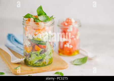 Tasty served salad wuth prawns in jar on table. Ready to eat. Detox Clean Eating Concept Stock Photo