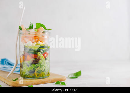 Tasty served salad wuth prawns in jar on table. Ready to eat. Detox Clean Eating Concept Stock Photo