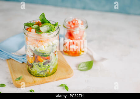 Tasty served salad wuth prawns in jar on table. Ready to eat. Detox Clean Eating Concept Stock Photo