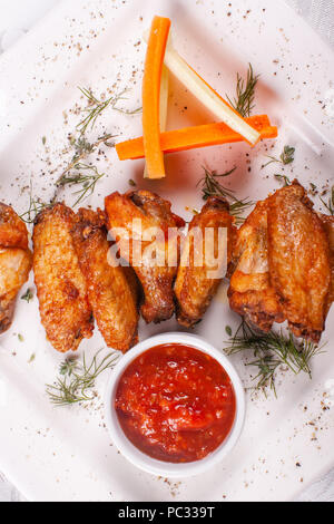 Hot and spicy hot meat dishes. Buffalo Grilled chicken wings with red spicy sauce