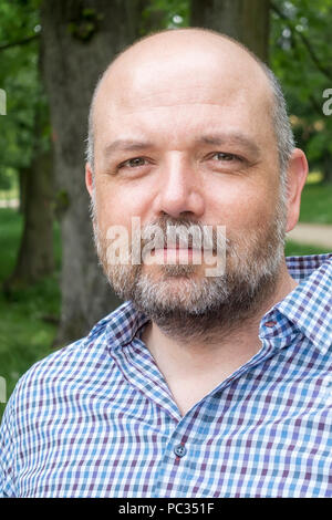 An image of a handsome bearded man portrait outdoors Stock Photo