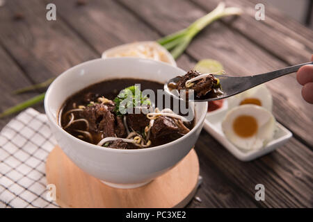 Rawon. traditional Indonesian beef black soup Stock Photo