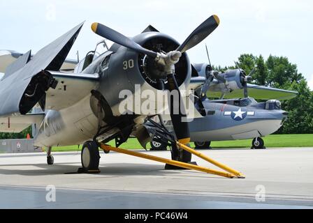 A Grumman FM-2 Wildcat (foreground) and a Consolidated Catalina PBY-5A (rear) on display at the Military Aviation Museum in Virginia Beach, Virginia. (US Navy Photo by Civilian Public Affairs Officer Max Lonzanida/Released) Stock Photo