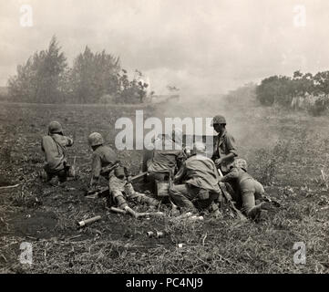 Marines on Saipan fire 37mm Artillery piece Stock Photo