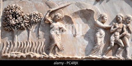 6284. Adam and Eve are driven out from Paradise. Relief from the Cathedral of Assumption in Overto, Italy. Stock Photo
