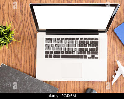 traveler  business man concept image on wooden desk ,headphones , pot of grass  Stock Photo