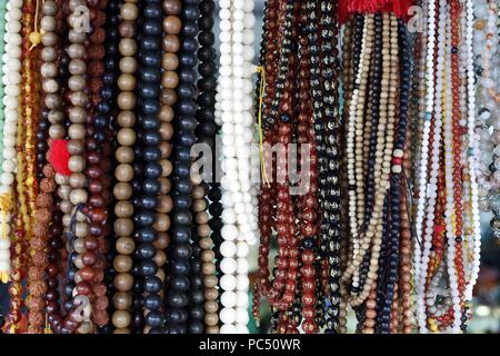 Truc Lam buddhist temple. Various buddhist religious merchandise items on sale. Prayer beads or malas.  Dalat. Vietnam. | usage worldwide Stock Photo