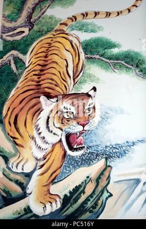 Hoi Tuong Te Nguoi Hoa buddist chinese temple. Tiger painting.  Phu Quoc. Vietnam. | usage worldwide Stock Photo