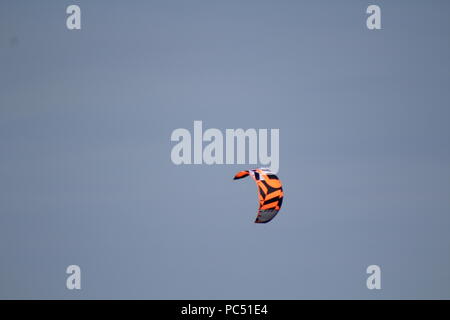 kite flying in blue sky Stock Photo