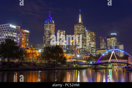 Yarra River and  Melbourne city at night looking towards Flinders Street Station . Australia