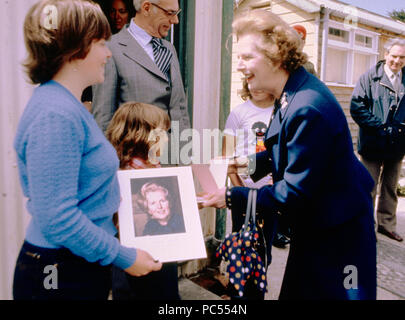 Prime Minister Margaret Thatcher signs her autograph at Stanley Junior School, during her visit to the Falkland Islands. Stock Photo