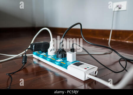 Multi-socket Power Strip with a bunch of plugs on it Stock Photo