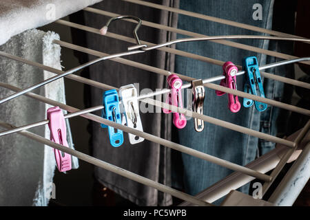 Clothespins with clothes hanger Stock Photo