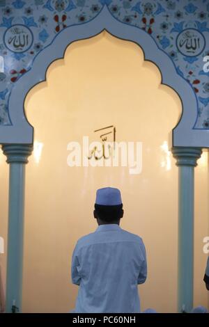 Masjid Al Rahim Mosque. Rear view of muslim man praying.  Ho Chi Minh City.  Vietnam. | usage worldwide Stock Photo