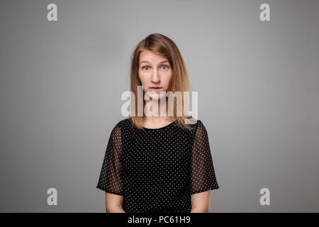 young european sad woman serious and concerned looking worried and thoughtful Stock Photo