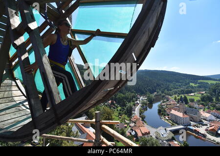 Ongoing repair of Jakobinka Tower by old techniques at the local castle in Rozmberk nad Vltavou, Czech Republic, on July 31, 2018. On the photo a volunteer spins a replica of medieval crane inspired by drawings by Leonardo da Vinci. (CTK Photo/Vaclav Pancer) Stock Photo