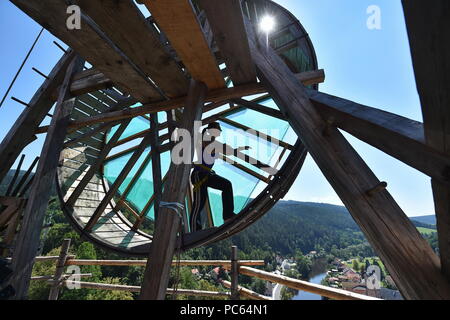 Ongoing repair of Jakobinka Tower by old techniques at the local castle in Rozmberk nad Vltavou, Czech Republic, on July 31, 2018. On the photo a volunteer spins a replica of medieval crane inspired by drawings by Leonardo da Vinci. (CTK Photo/Vaclav Pancer) Stock Photo