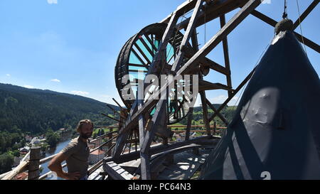 Ongoing repair of Jakobinka Tower by old techniques at the local castle in Rozmberk nad Vltavou, Czech Republic, on July 31, 2018. On the photo a volunteer spins a replica of medieval crane inspired by drawings by Leonardo da Vinci. (CTK Photo/Vaclav Pancer) Stock Photo